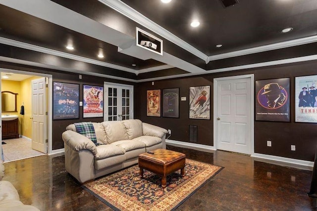 cinema with french doors, a raised ceiling, and ornamental molding