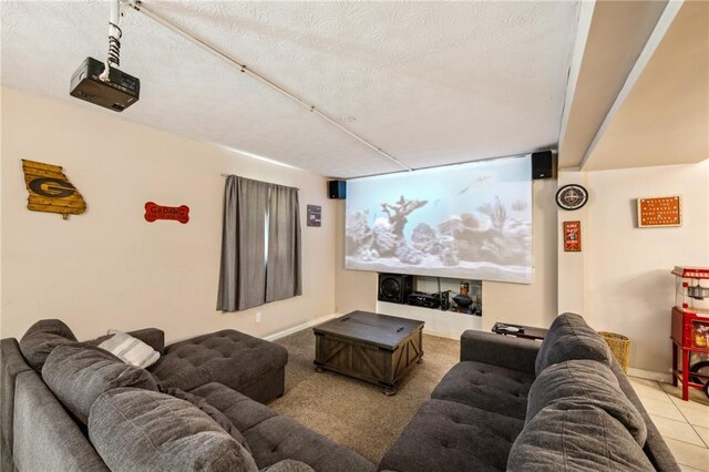 cinema room featuring a textured ceiling and baseboards
