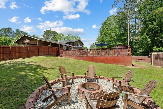 view of yard with a fire pit