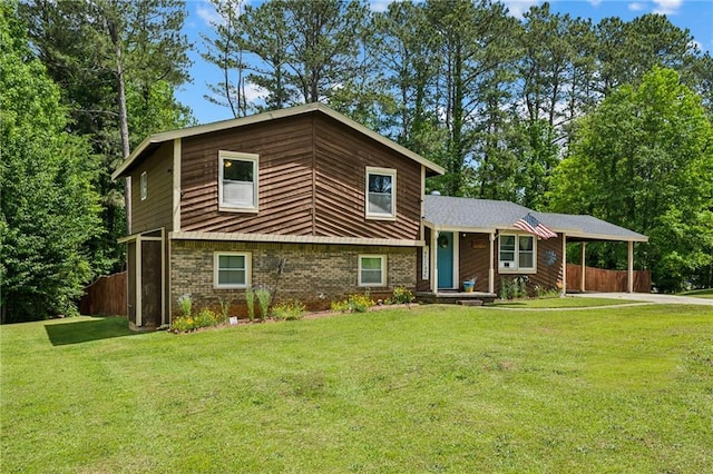 tri-level home with a carport and brick siding