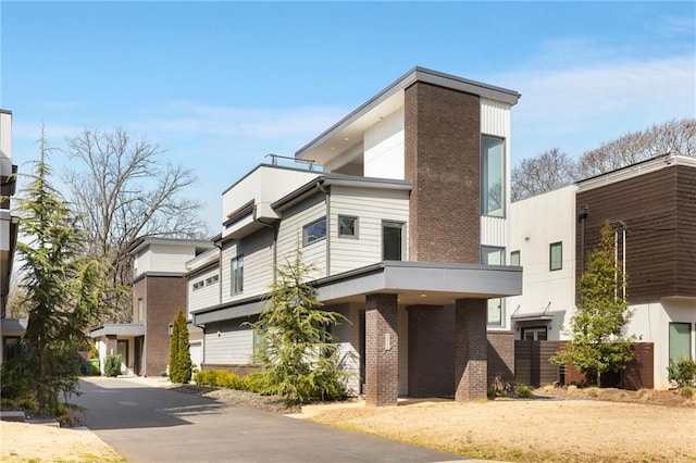 view of front of property featuring brick siding