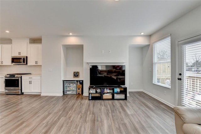 living room with light hardwood / wood-style floors