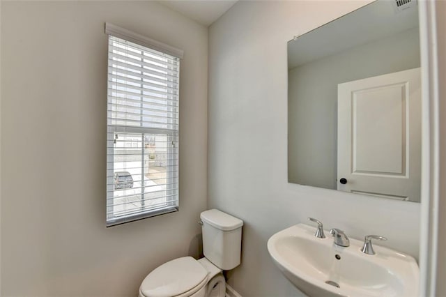 bathroom featuring sink and toilet