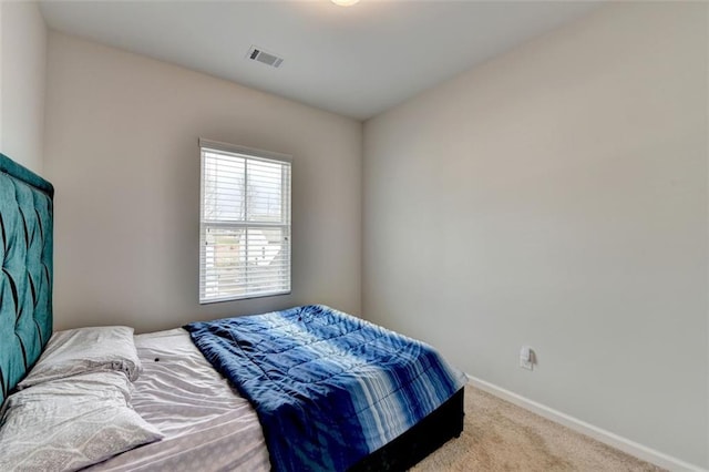 bedroom featuring light colored carpet