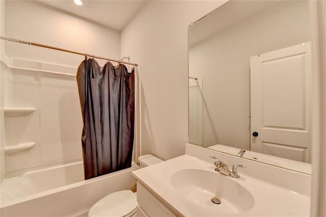 full bathroom with vanity, toilet, and shower / tub combo