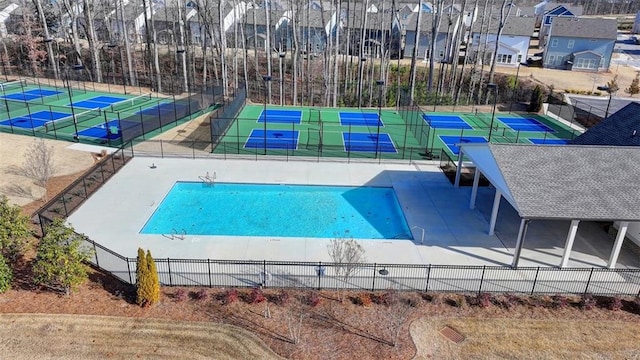 view of pool with tennis court