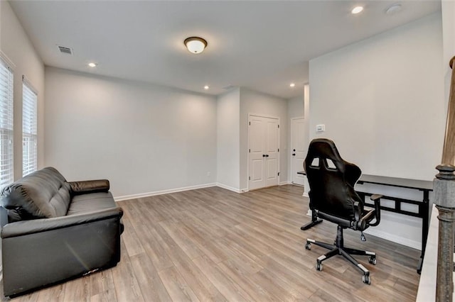 office space with light hardwood / wood-style floors