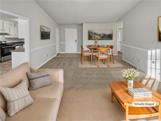 living room featuring light carpet and lofted ceiling