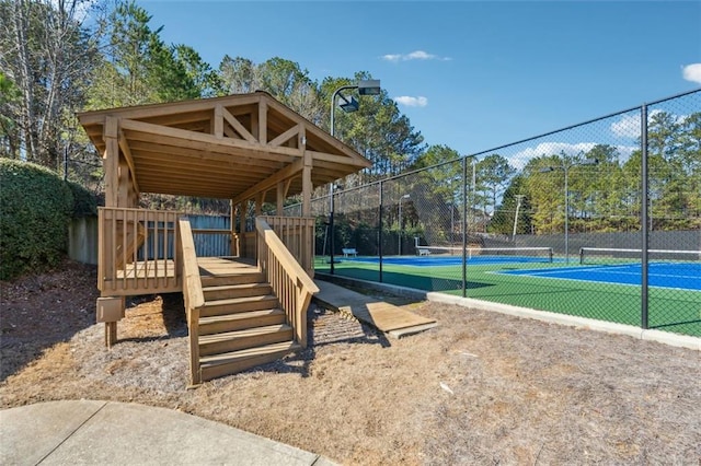 view of playground featuring tennis court