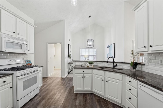 kitchen with white cabinetry and white appliances