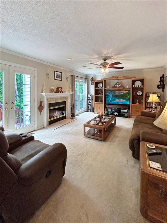 21 Picketts Ridge Ln, Acworth, GA 30101 - living area with crown molding, carpet floors, a textured ceiling, a high end fireplace, and ceiling fan
