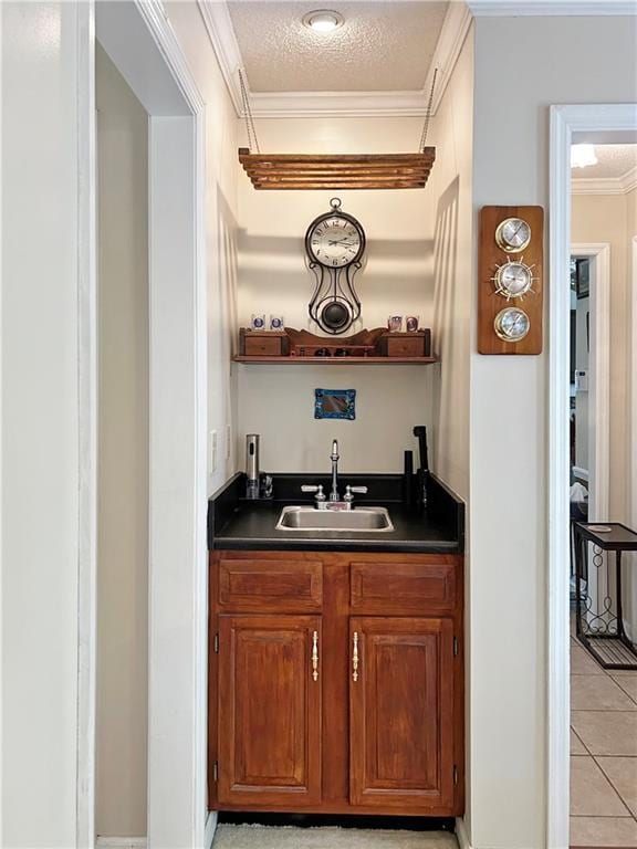 21 Picketts Ridge Ln, Acworth, GA 30101 - indoor wet bar featuring crown molding, light tile patterned floors, and a textured ceiling