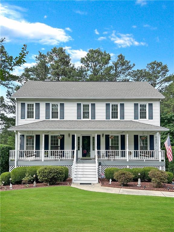 21 Picketts Ridge Ln, Acworth, GA 30101 - colonial-style house with a porch and a front yard