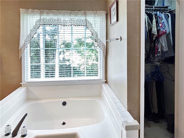 21 Picketts Ridge Ln, Acworth, GA 30101 - bathroom featuring plenty of natural light, a spacious closet, and a bath