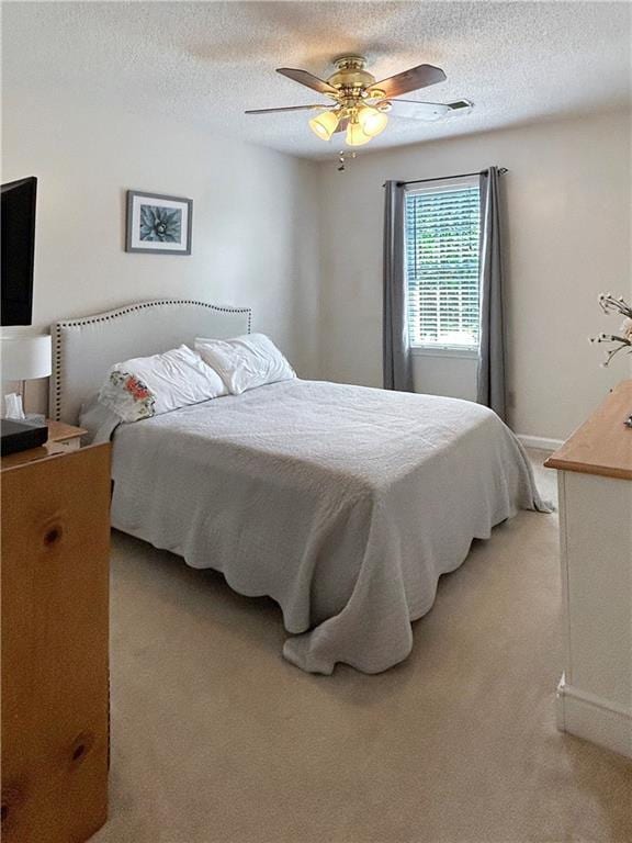 21 Picketts Ridge Ln, Acworth, GA 30101 - bedroom featuring light colored carpet, a textured ceiling, and ceiling fan