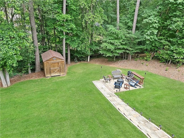 21 Picketts Ridge Ln, Acworth, GA 30101 - view of green lawn with a patio area and an outdoor fire pit