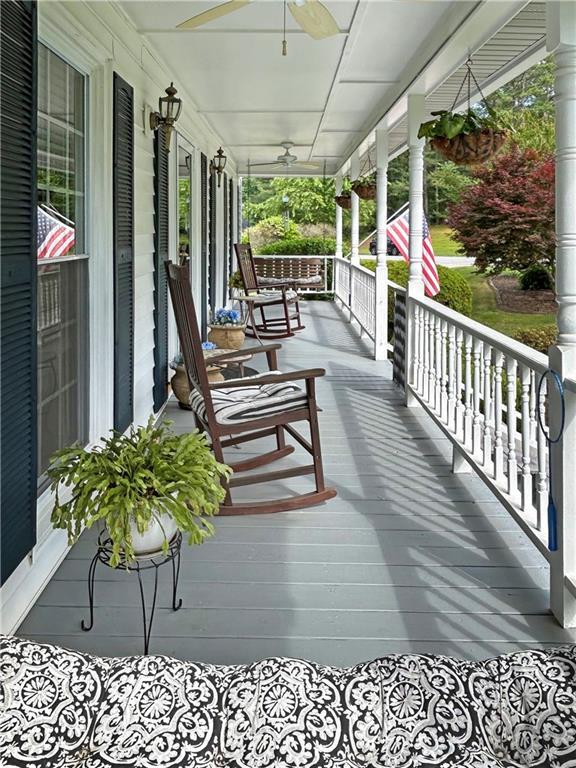 21 Picketts Ridge Ln, Acworth, GA 30101 - wooden porch featuring a ceiling fan