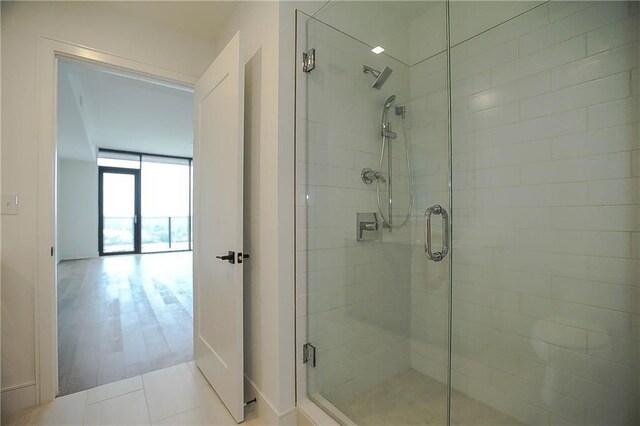 788 W Marietta St NW Unit 811, Atlanta, GA 30318 - full bathroom with a shower stall and baseboards