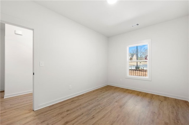 spare room featuring light hardwood / wood-style flooring