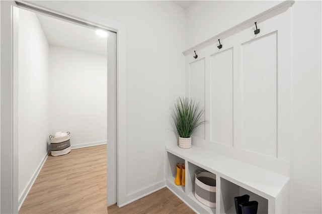 mudroom with light hardwood / wood-style flooring