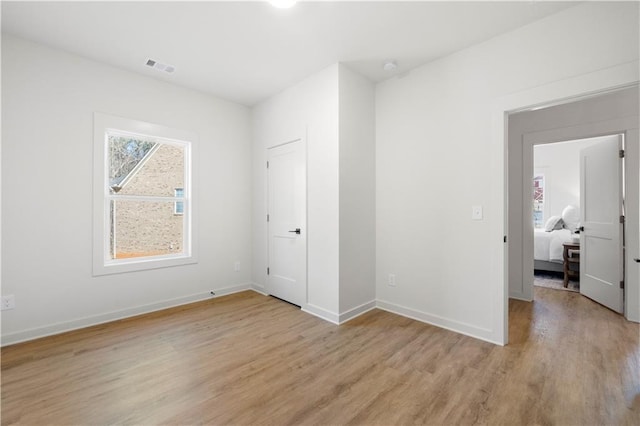 unfurnished bedroom featuring light hardwood / wood-style floors