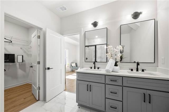 bathroom featuring vanity and walk in shower