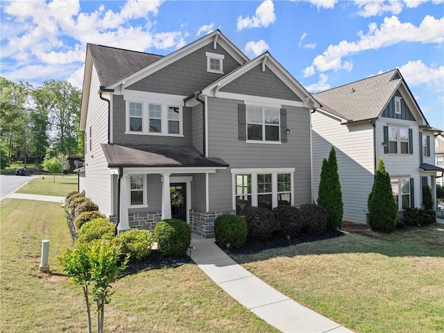 5924 Waterway Pl, Flowery Branch, GA 30542 - craftsman-style home featuring a front yard, covered porch, and roof with shingles