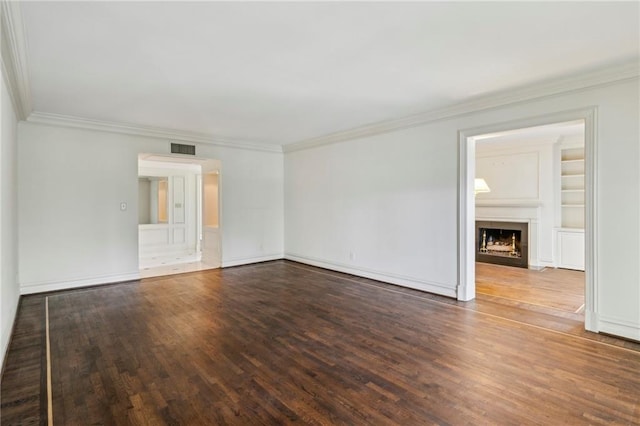 2769 Peachtree Rd NE Unit 7, Atlanta, GA 30305 - empty room with ornamental molding, wood finished floors, a fireplace, and built in shelves