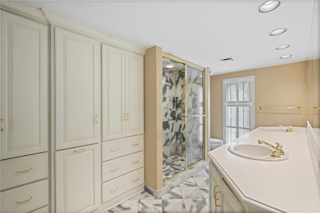 2769 Peachtree Rd NE Unit 7, Atlanta, GA 30305 - bathroom featuring marble finish floors, a shower stall, vanity, and recessed lighting