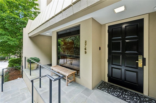 2769 Peachtree Rd NE Unit 7, Atlanta, GA 30305 - doorway to property with board and batten siding and stucco siding