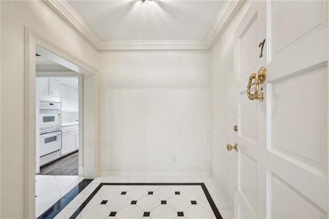 2769 Peachtree Rd NE Unit 7, Atlanta, GA 30305 - hallway with inlaid floor details, light tile patterned flooring, and crown molding