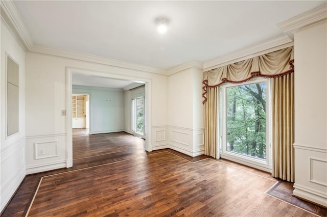 2769 Peachtree Rd NE Unit 7, Atlanta, GA 30305 - empty room with plenty of natural light, ornamental molding, wood finished floors, a decorative wall, and a wainscoted wall