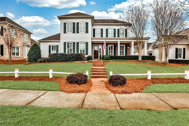 view of front of property with a front lawn