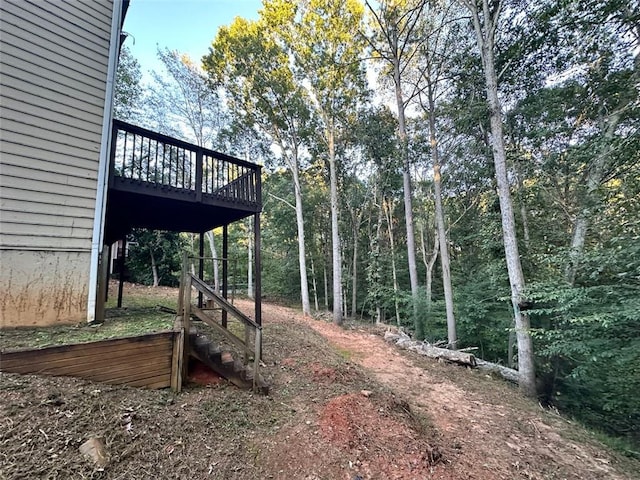 view of yard featuring a wooden deck