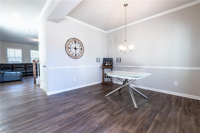 dining space with ornamental molding, dark hardwood / wood-style floors, and a chandelier