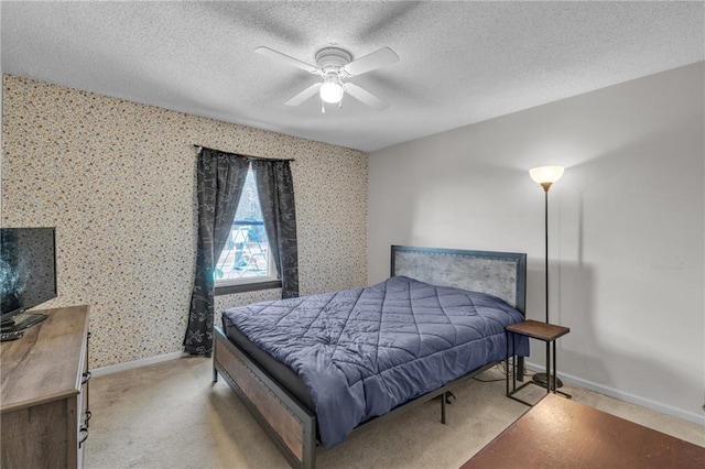 bedroom featuring wallpapered walls, carpet flooring, baseboards, and a textured ceiling