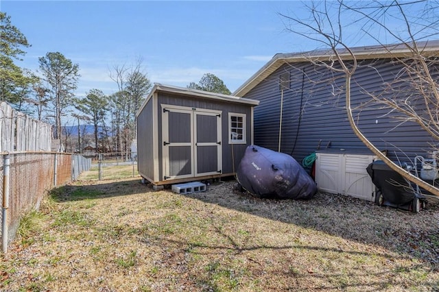 view of shed with a fenced backyard