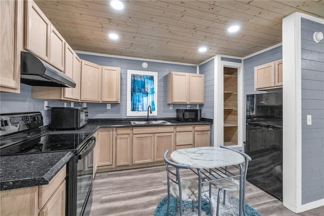 kitchen featuring light brown cabinets, a sink, black appliances, under cabinet range hood, and wooden ceiling