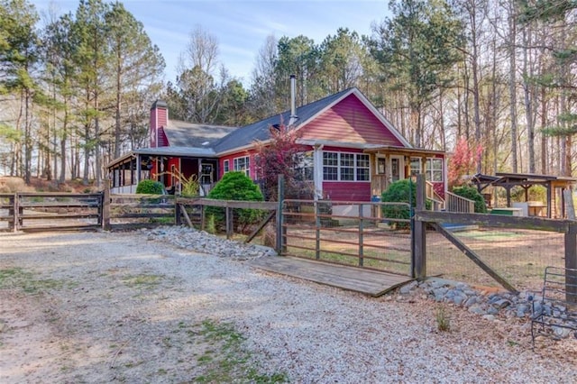 chalet / cabin featuring a chimney