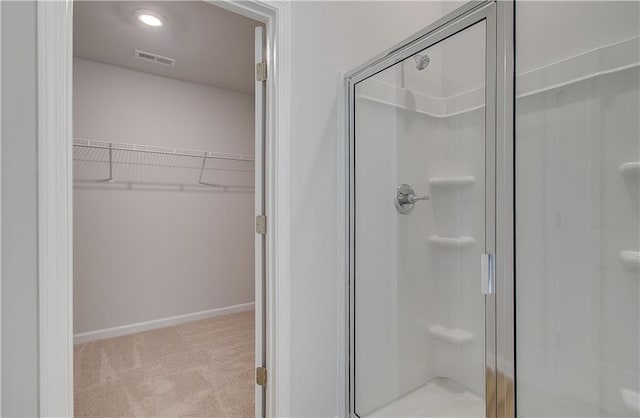 bathroom featuring walk in shower