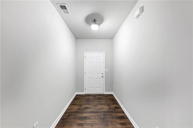 entryway featuring baseboards, visible vents, and dark wood-style flooring