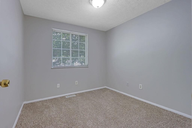 5295 Old Trail Cir, Stone Mountain, GA 30088 - empty room with a textured ceiling, carpet flooring, and baseboards