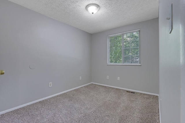 5295 Old Trail Cir, Stone Mountain, GA 30088 - empty room with carpet floors, a textured ceiling, and baseboards