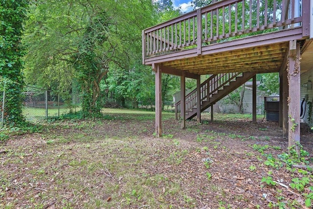 5295 Old Trail Cir, Stone Mountain, GA 30088 - view of yard featuring fence, a deck, and stairway