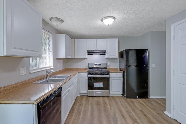 5295 Old Trail Cir, Stone Mountain, GA 30088 - kitchen with black appliances, a sink, extractor fan, white cabinetry, and light wood-style flooring