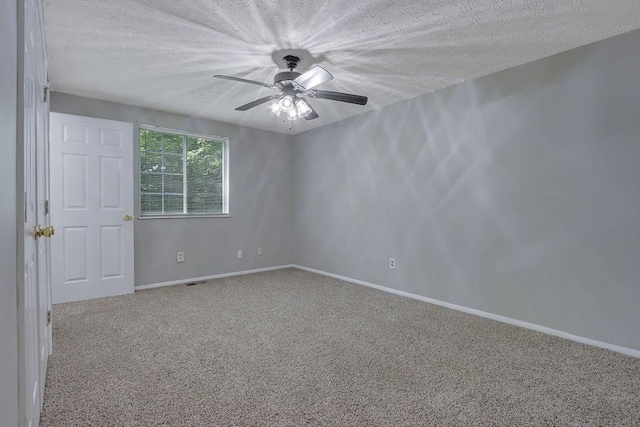5295 Old Trail Cir, Stone Mountain, GA 30088 - carpeted spare room with a textured ceiling, ceiling fan, and baseboards