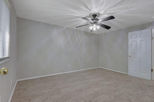 5295 Old Trail Cir, Stone Mountain, GA 30088 - carpeted empty room featuring a ceiling fan, a textured ceiling, and baseboards