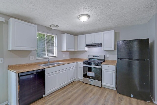 5295 Old Trail Cir, Stone Mountain, GA 30088 - kitchen featuring black appliances, under cabinet range hood, a sink, white cabinets, and a textured ceiling