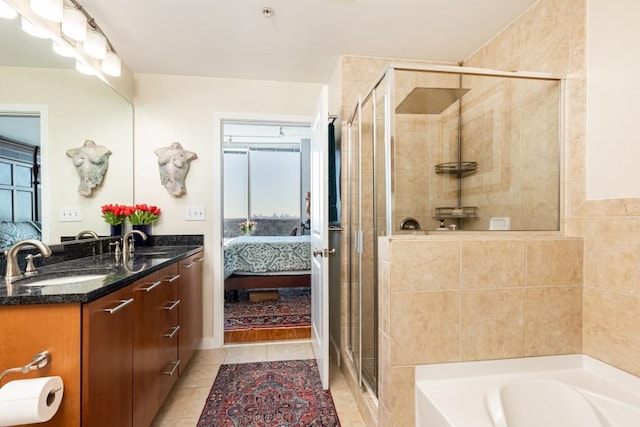 bathroom with tile patterned flooring, plenty of natural light, shower with separate bathtub, and vanity