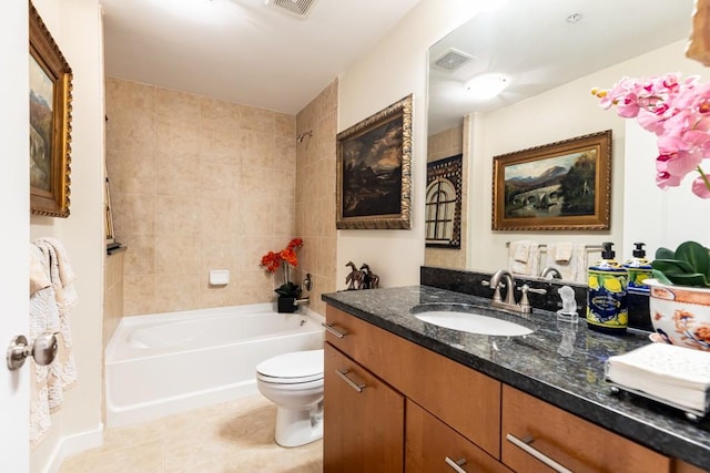 full bathroom featuring tile patterned flooring, vanity, toilet, and tiled shower / bath combo